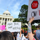 Protesters rally against one of the nation’s most restrictive bans on abortions on May 19, 2019, in Montgomery, Ala.